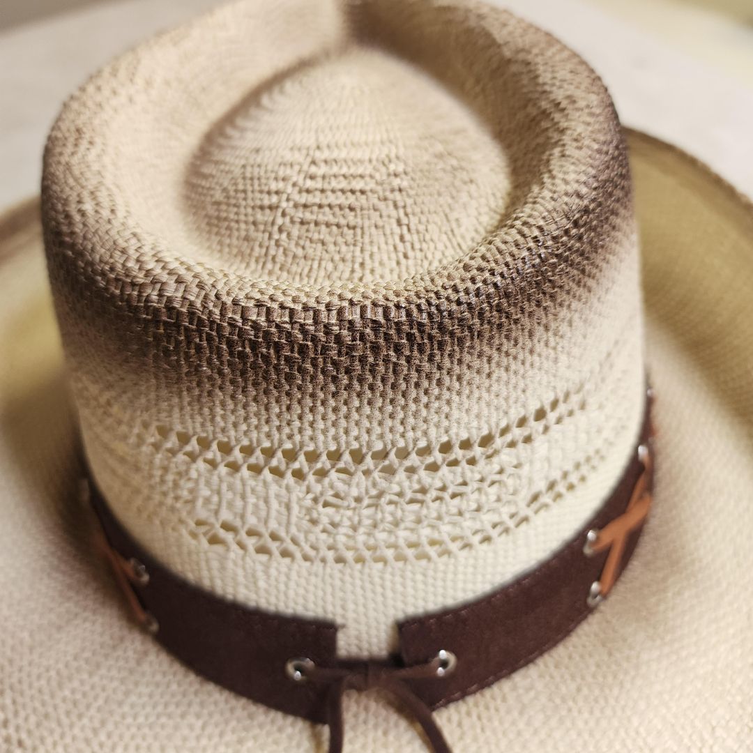 Straw cowboy hat blend and a striking blue gemstone