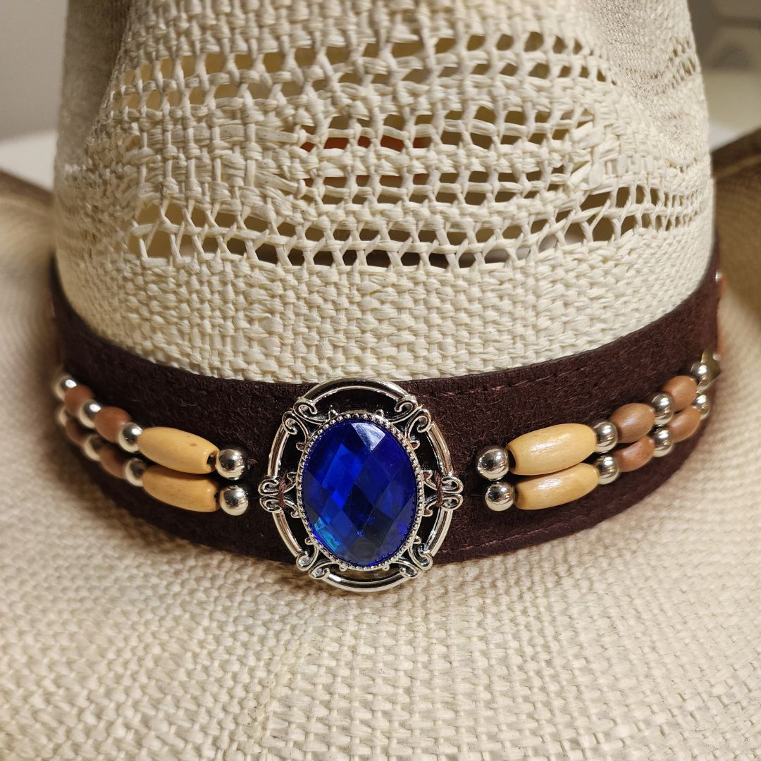 Straw cowboy hat blend and a striking blue gemstone
