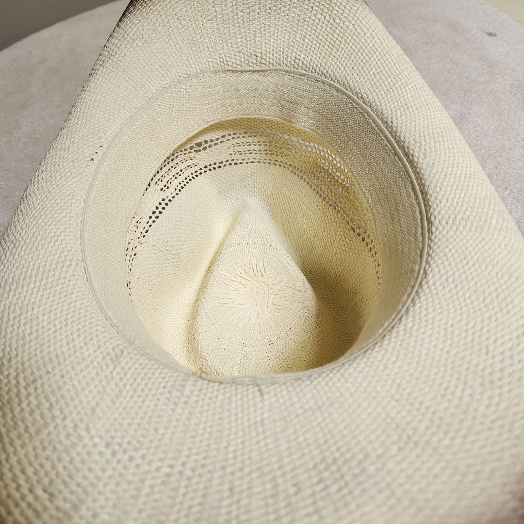 Straw cowboy hat blend and a striking blue gemstone